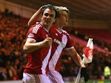 Patrick Bamford of Middlesbrough celebrates scoring the opening goal with Enrique Garcia during the Sky Bet Championship match against Millwall on March 3, 2015