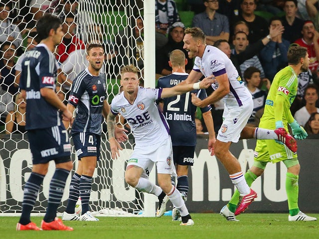 Andrew Keogh of the Glory celebrates after scoring the first goal during the round 20 A-League match between Melbourne Victory and Perth Glory at AAMI Park on March 7, 2015