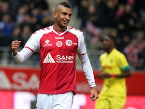 Reims' French forward David Ngog celebrates after scoring a goal during the French Football match Reims vs Nantes, on March 7, 2015