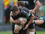 Sam Lewis of the Ospreys is tackled during the Heineken Cup pool 1 match between Northampton Saints and Ospreys at Franklin's Gardens on October 20, 2013