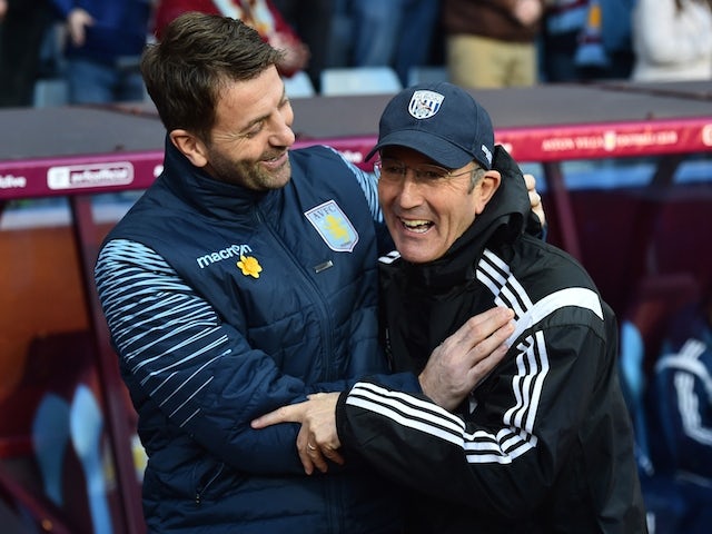 West Bromwich Albion's Welsh Head Coach Tony Pulis greets Aston Villa's English manager Tim Sherwood (L) ahead of the FA Cup quarter-final match  on March 7, 2015