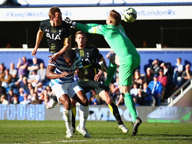 Harry Kane of Spurs beats Robert Green of QPR to score their first goal with a header during the Barclays Premier League match between Queens Park Rangers and Tottenham Hotspur at Loftus Road on March 7, 2015