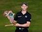 Trevor Fisher Jnr of South Africa poses with the trophy after winning the Africa Open at East London Golf Club on March 8, 2015