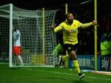 Troy Deeney of Watford celebrates scoring the first goal during the Sky Bet Championship match between Watford and Fulham at Vicarage Road on March 3, 2015
