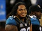 Jaguars 're-sign defensive end Alualu'