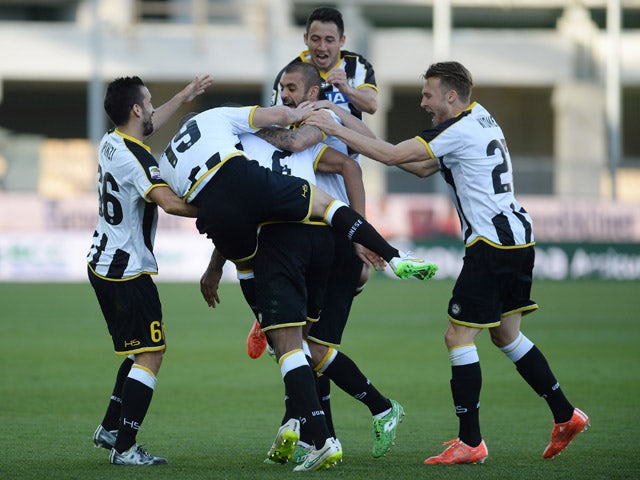 Molla Wague #2 of Udinese Calcio is mobbed by team mates after scoring his team's third goal during the Serie A match between Udinese Calcio and Torino FC at Stadio Friuli on March 8, 2015