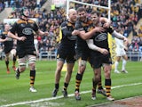 Elliot Daly of Wasps celebrates with team mates after scoring a try during the Aviva Premiership match between Wasps and Saracens at The Ricoh Arena on March 8, 2015