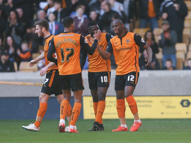 Benik Afobe Of Wolves Celebrates With Team Mates After Scoring The ...