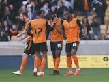 Benik Afobe of Wolves celebrates with team mates after scoring the opening goal of the game during the Sky Bet Championship match between Wolverhampton Wanderers and Watford at Molineux on March 7, 2015
