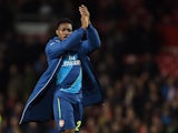 Matchwinning goal scorer Danny Welbeck of Arsenal applauds the travelling fans following their team's 2-1 victory during the FA Cup Quarter Final match between Manchester United and Arsenal at Old Trafford on March 9, 2015