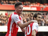 Arsenals French midfielder Mathieu Flamini celebrates scoring his goal with Arsenals French striker Olivier Giroud during the English Premier League football match between Arsenal and West Ham United at The Emirates Stadium in London on March 14, 2015