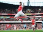 Olivier Giroud of Arsenal celebrates scoring the opening goal during the Barclays Premier League match between Arsenal and West Ham United at Emirates Stadium on March 14, 2015