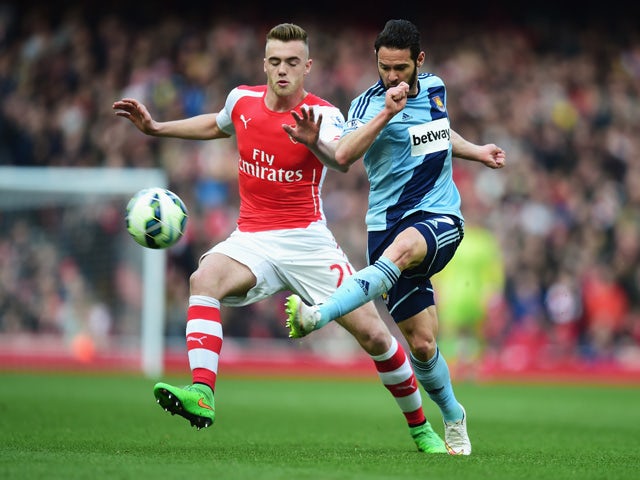 Matthew Jarvis of West Ham United is closed down by Calum Chambers of Arsenal during the Barclays Premier League match between Arsenal and West Ham United at Emirates Stadium on March 14, 2015