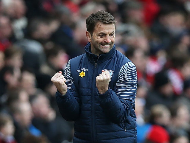 Aston Villas English Manager Tim Sherwood celebrates his team's opening goal during the English Premier League football match between Sunderland and Aston Villa at the Stadium of Light in Sunderland, northeast England on March 14, 2015