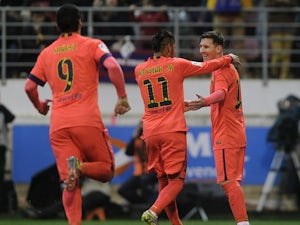 Messi double puts Barca four clear