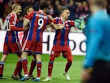 Bayern Munich's French midfielder Franck Ribery celebrates scoring the 3-0 goal with his team-mates during the UEFA Champions League second-leg, Round of 16 football match FC Bayern Munich vs Shakhtar Donetsk in Munich, southern Germany, on March 11, 2015