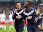 Bordeaux's French Senegalese defender Lamine Sane celebrates with a teammate after scoring a goal during the French L1 football match between Bordeaux (FCGB) and Paris-Saint-Germain (PSG) on March 15, 2015