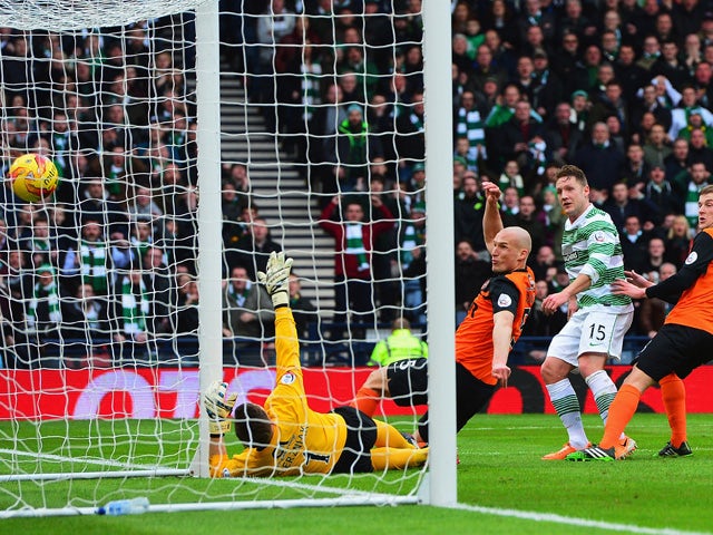Kris Commons of Celtic scores the opening goal during the Scottish League Cup Final between Dundee United and Celtic at Hampden Park on March 15, 2015
