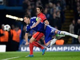 John Terry of Chelsea heads the ball clear before it can reach Edinson Cavani of PSG during the UEFA Champions League Round of 16, second leg match between Chelsea and Paris Saint-Germain at Stamford Bridge on March 11, 2015