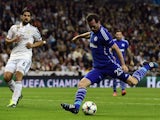 Schalke's Austrian defender Christian Fuchs (R) kicks and scores during the UEFA Champions League round of 16 second leg football match against Real Madrid  on March 10, 2015