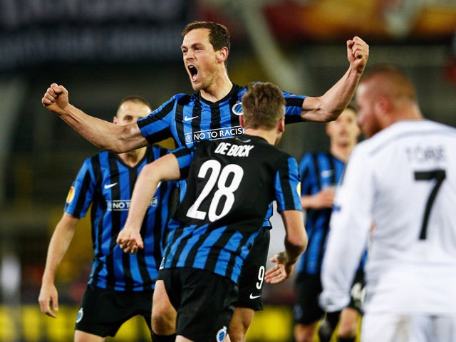 Tom De Sutter #9 of Club Brugge celebrates scoring his teams first goal of the game with team mates during the UEFA Europa League Round of 16 1st leg match between Club Brugge KV and Besiktas JK held at the Jan Breydel Stadium on March 12, 2015