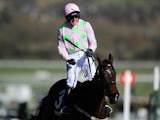 Ruby Walsh celebrates on board Douvan after winning The Sky Bet Supreme Novices' Hurdle Race during Day One of the Cheltenham Festival at Cheltenham Racecourse on March 10, 2015