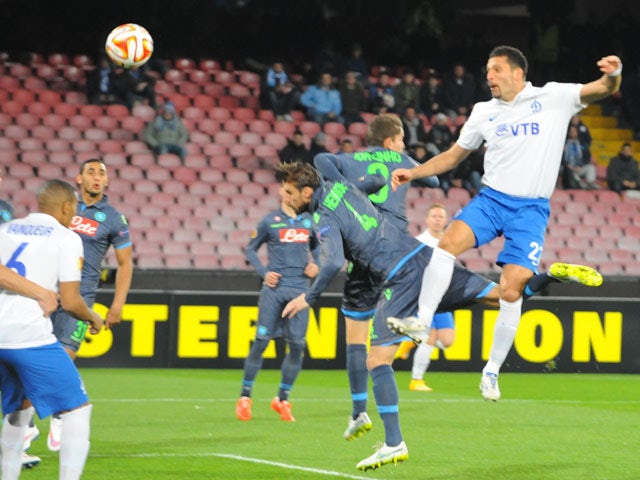 Dinamo Moscow's German forward Kevin Kuranyi heads the ball and scores during the UEFA Europa League Round of 16 first leg football match SSC Napoli vs FK Dinamo Moskva on March 12, 2015