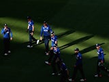 English players come from the field at the innings break during the 2015 ICC Cricket World Cup match between England and Bangladesh at Adelaide Oval on March 9, 2015