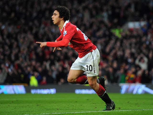 Fabio Da Silva of Manchester United celebrates scoring the opening goal during the FA Cup sponsored by E.On Sixth Round match between Manchester United and Arsenal at Old Trafford on March 12, 2011