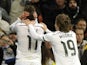 Real Madrid's Welsh forward Gareth Bale (L) celebrates a goal with teammate Real Madrid's Croatian midfielder Luka Modric (2nd L) during the Spanish league football match on March 15, 2015