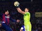 Luis Suarez of FC Barcelona competes for the ball with the goalkeeper Geronimo Rulli of Real Sociedad during the La Liga match between Real Sociedad de Futbol and FC Barcelona at Estadio Anoeta on January 4, 2015