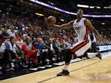 Hassan Whiteside #21 of the Miami Heat saves the ball from going out of bounds during a game against the Atlanta Hawks at American Airlines Arena on February 28, 2015