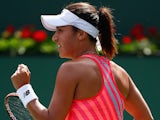 Heather Watson of Great Britain celebrates winning the first set against Agnieszka Radwanska of Poland during day seven of the BNP Paribas Open tennis on March 15, 2015