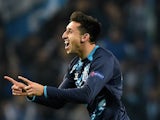 Porto's Mexican midfielder Hector Herrera celebrates after scoring a goal during the UEFA Champions League round of 16 second leg football match  against Basel on March 10, 2015