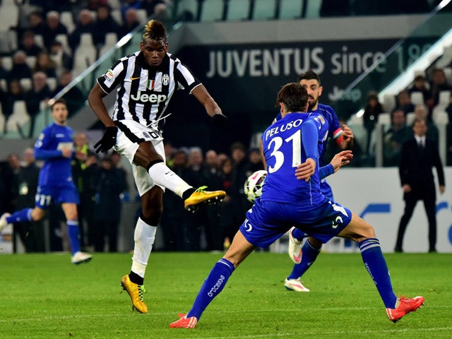 Juventus' midfielder from France Paul Pogba kicks and scores a goal during their Serie A football match Juventus vs Sassuolo at 'Juventus Stadium' in Turin on March 09, 2015
