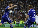 Schalke's Dutch forward Klaas-Jan Huntelaar (L) celebrates after scoring with Schalke's midfielder Max Meyer (R) during the UEFA Champions League round of 16 second leg football match  against Real Madrid on March 10, 2015