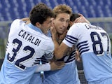 Lazio's Argentinian midfielder Lucas Biglia celebrates with teammates after scoring against Fiorentina on March 9, 2015