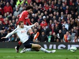 Marouane Fellaini of Manchester United shoots past Eric Dier of Spurs to score the opening goal during the Barclays Premier League match between Manchester United and Tottenham Hotspur at Old Trafford on March 15, 2015