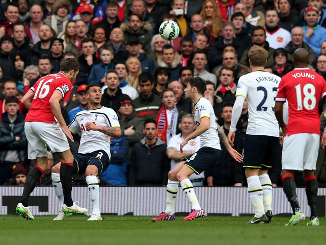 Michael Carrick of Manchester United scores his team's second goal with a header during the Barclays Premier League match between Manchester United and Tottenham Hotspur at Old Trafford on March 15, 2015 