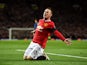 Wayne Rooney of Manchester United celebrates after scoring a goal to level the scores at 1-1 during the FA Cup Quarter Final match between Manchester United and Arsenal at Old Trafford on March 9, 2015