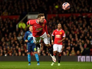 Half-Time Report: Arsenal pegged back by United