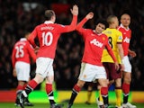 Wayne Rooney of Manchester United celebrates scoring his side's second gaol with teammate Rafael Da Silva during the FA Cup sponsored by E.On Sixth Round match between Manchester United and Arsenal at Old Trafford on March 12, 2011