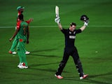 Martin Guptill of New Zealand celebrates after scoring a century during the 2015 ICC Cricket World Cup match between Bangladesh and New Zealand at Seddon Park on March 13, 2015