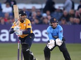 Owais Shah of Hampshire hits out while Ben Brown of Sussex looks on during the Natwest T20 Blast match between Sussex Sharks and Hampshire at The BrightonandHoveJobs.com County Ground on May 23, 2014