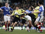 Joey Barton of Manchester City battles with Pedro Mendes of Portsmouth during a Premier League game on March 11, 2006