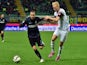 Inter Milan's forward from Argentina Rodrigo Palacio fights for the ball with Cesena's midfielder from Iceland Hordur Bjorgvin Magnusson (R) during the Serie A football match on March 15, 2015