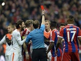 Scottish referee William Collum shows the red card to Shakhtar Donetsk's defender Olexandr Kucher during the UEFA Champions League second-leg round of 16 football match FC Bayern Munich vs Shaktar Donetsk in Munich, southern Germany, on March 11, 2015