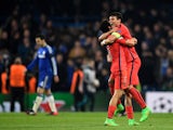 Marquinhos of PSG and Thiago Silva of PSG celebrate following their team's victory during the UEFA Champions League Round of 16, second leg match between Chelsea and Paris Saint-Germain at Stamford Bridge on March 11, 2015
