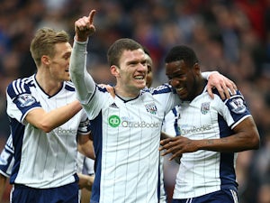 Brown Ideye of West Brom celebrates scoring the opening goal with team mates Darren Fletcher of West Brom and Craig Gardner of West Brom (C) during the Barclays Premier League match between West Bromwich Albion and Stoke City at The Hawthorns on March 14,