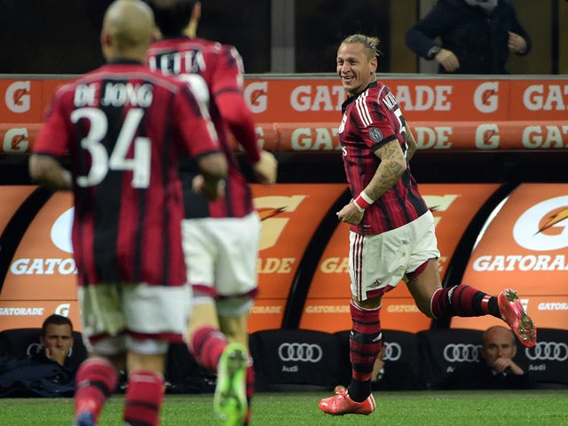 AC Milan's defender from France Philippe Mexes celebrates after scoring during the Italian Serie A football match AC Milan vs Cagliari on March 21, 2015